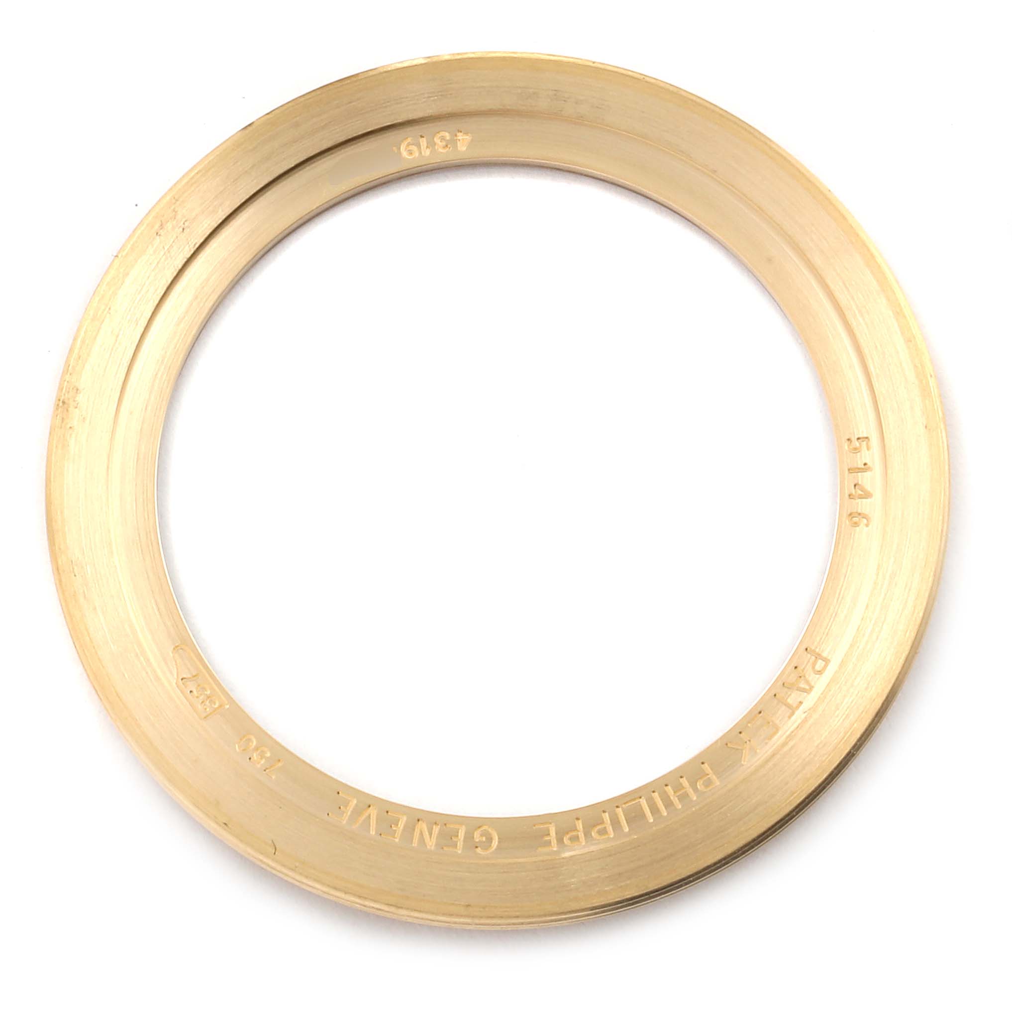 This image shows the bezel of a Patek Philippe 5146J - 01D Men's Yellow Gold Grey Dial 5146J - 01D Men's Yellow Gold Grey Dial Complicated Annual Calendar Yellow Gold Mens Watch 5146, viewed from above.