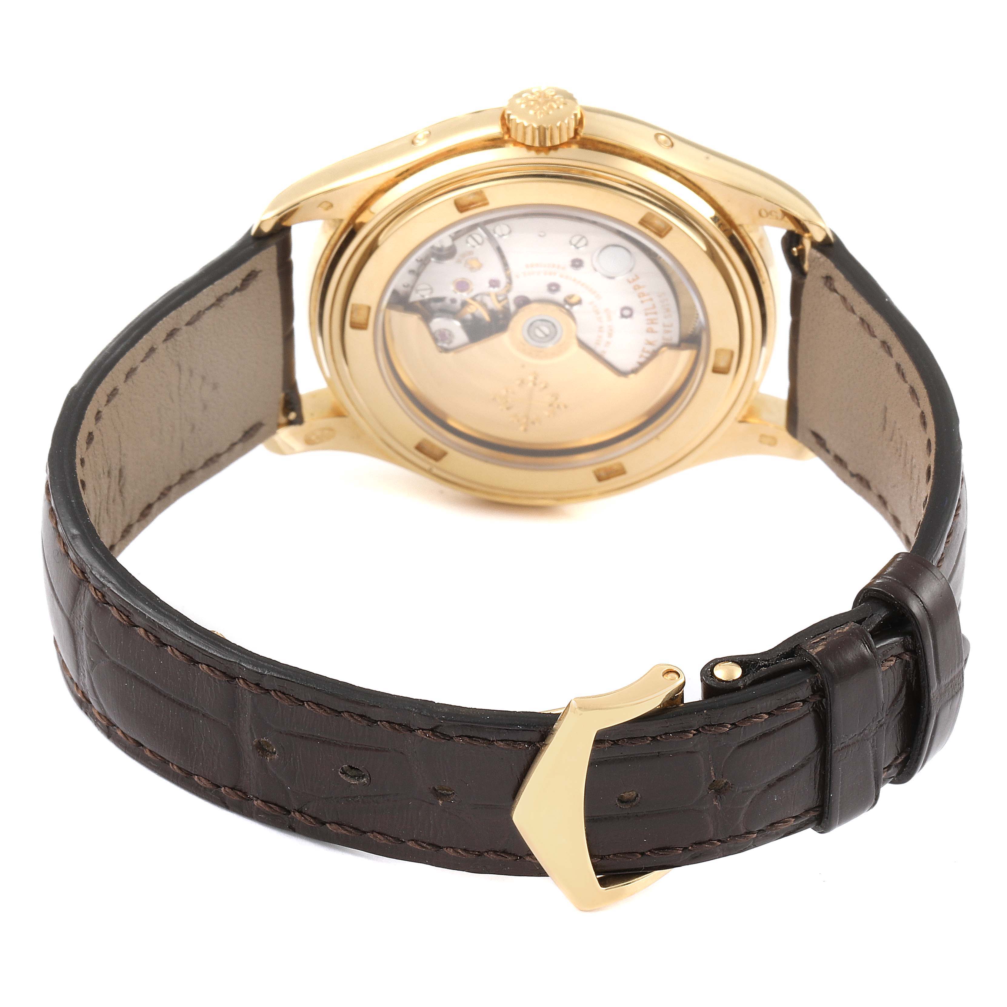 The image shows the rear view of the Patek Philippe 5146J - 01D Men's Yellow Gold Grey Dial 5146J - 01D Men's Yellow Gold Grey Dial Complicated Annual Calendar Yellow Gold Mens Watch 5146, highlighting the leather strap and transparent case back.