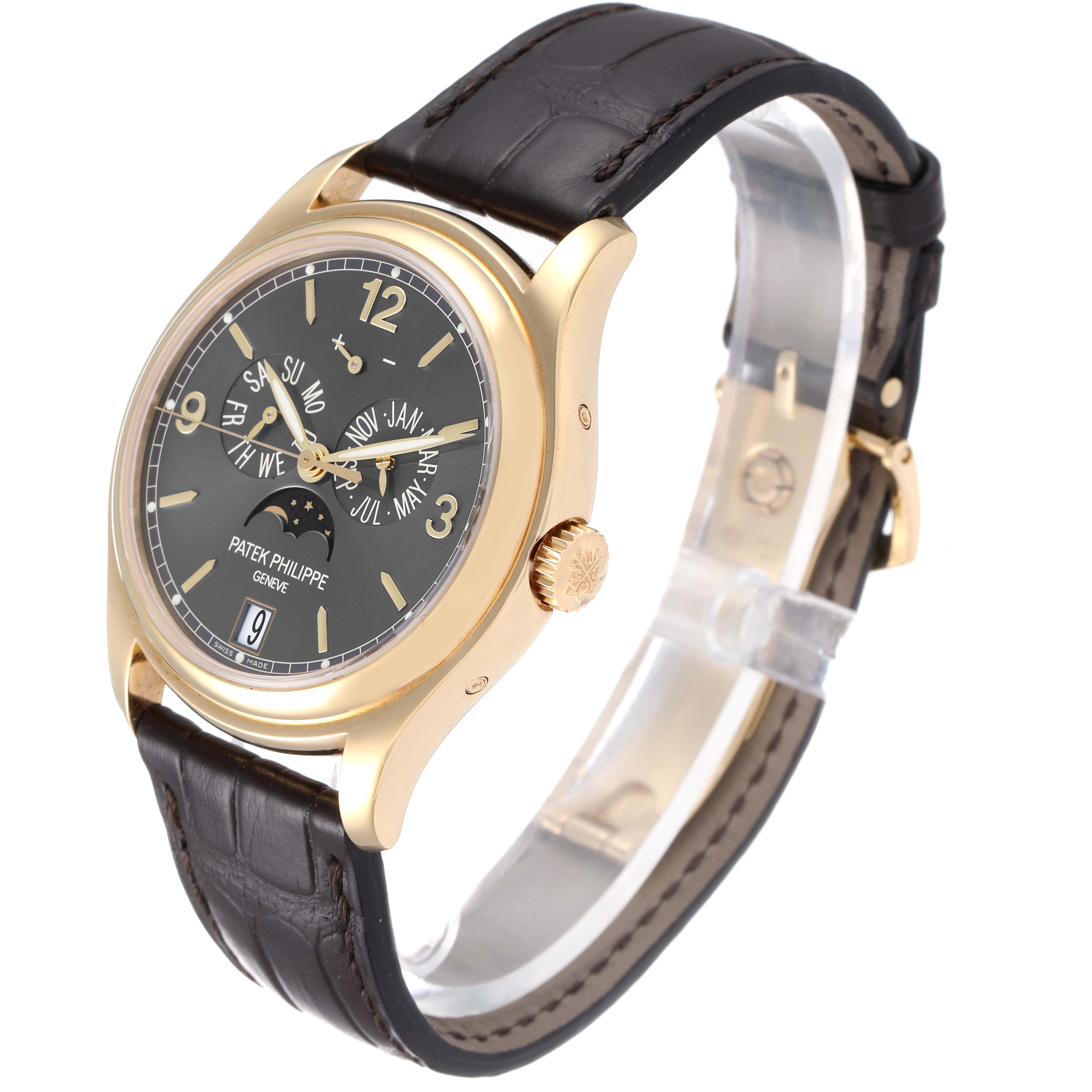 The image shows a Patek Philippe 5146J - 01D Men's Yellow Gold Grey Dial 5146J - 01D Men's Yellow Gold Grey Dial Complicated Annual Calendar Yellow Gold Men's Watch 5146, angled to display the face, crown, and strap.