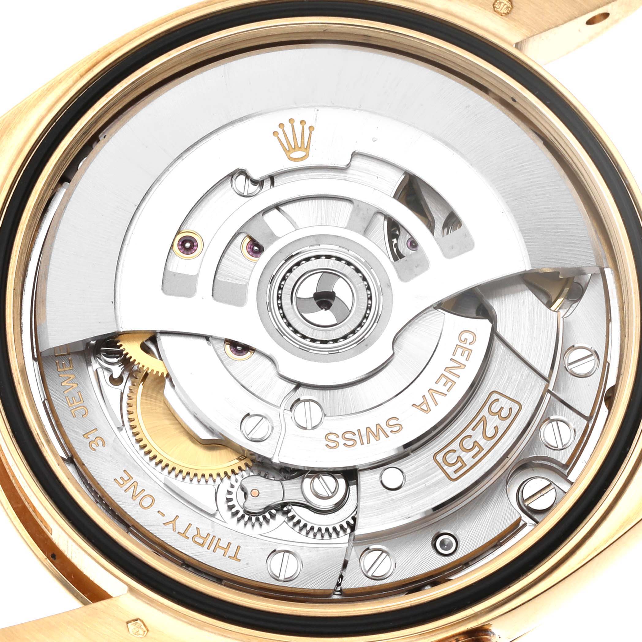 The image shows the internal mechanism of a Rolex President 128238 Men's Yellow Gold Green Dial 128238 Men's Yellow Gold Green Dial model watch from a back angle, highlighting gears and the rotor.