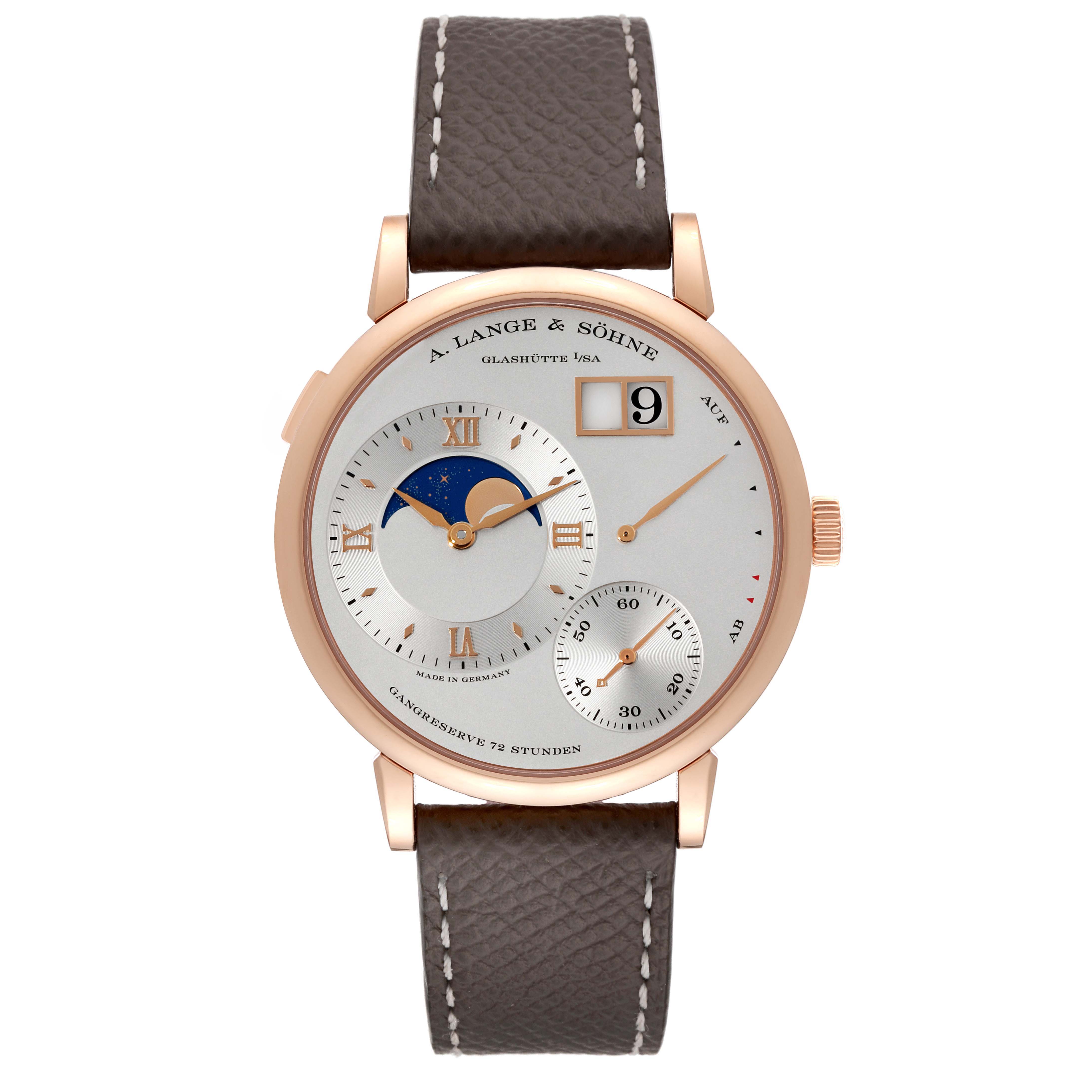 The image shows a front view of the Lange 1 watch by A. Lange & Söhne, featuring its dial, moon phase, and leather strap.
