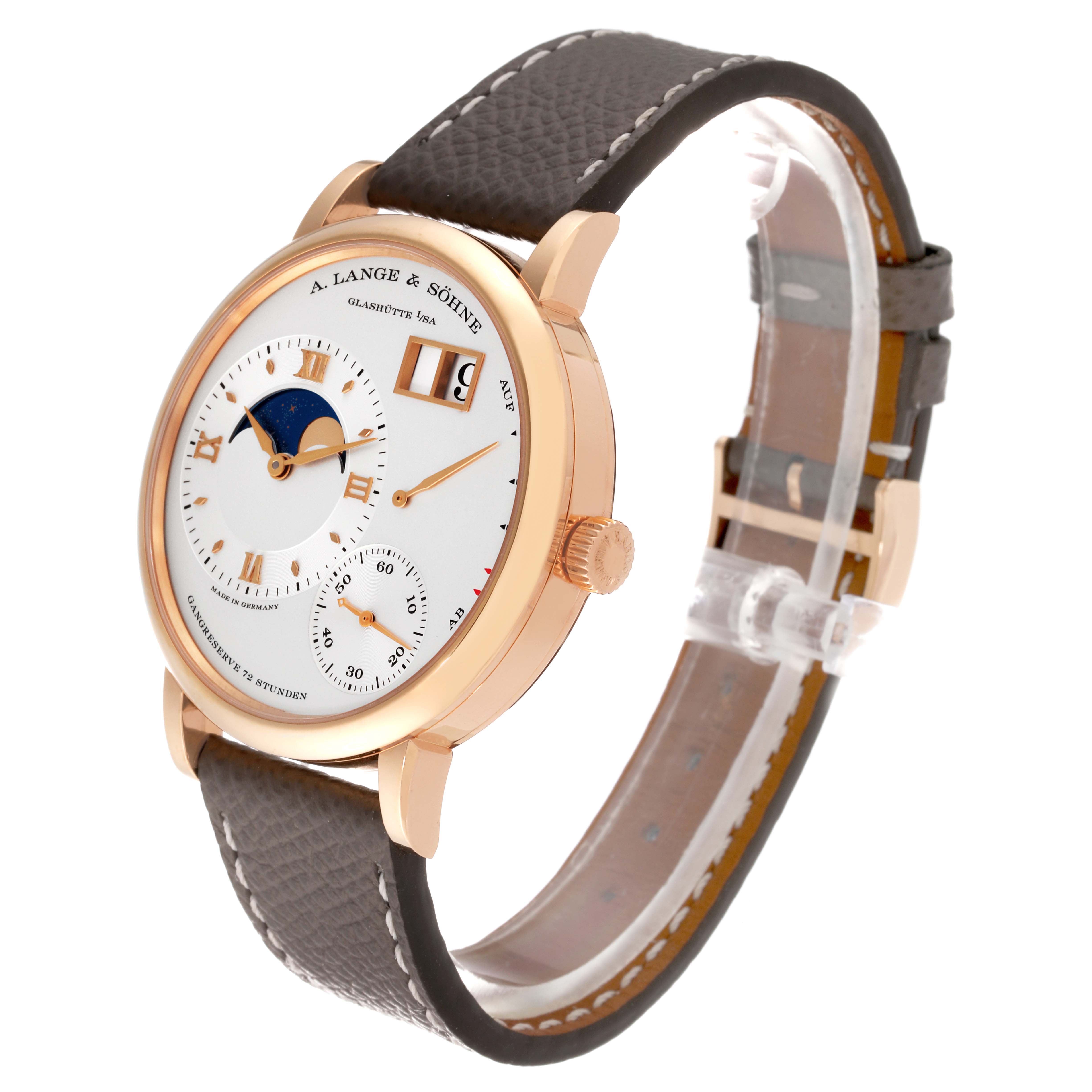 The image shows a side angle of the A. Lange & Sohne Lange 1 139.032 Men's Rose Gold Silver Dial watch, displaying its dial, case, crown, and leather strap.