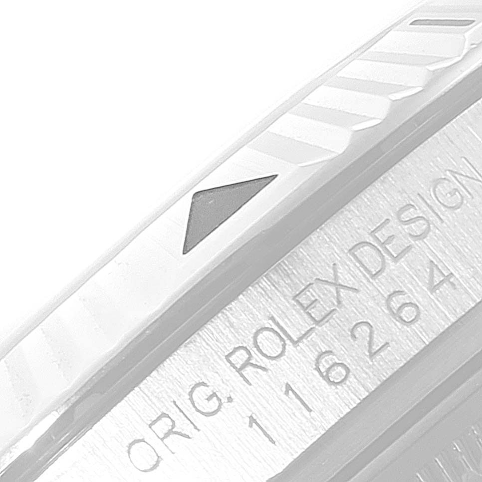 This image shows a close-up of the bezel and engraved serial number on a Rolex Turn-o-Graph 116264 Men's Stainless Steel Black Dial 116264 Men's Stainless Steel Black Dial watch.