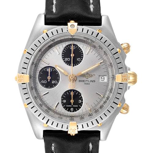 This image shows a front view of a Breitling Chronomat B13050 Men's Steel and Gold (two tone) Silver Dial B13050 Men's Steel and Gold (two tone) Silver Dial watch, highlighting its face, bezel, subdials, and a portion of its leather strap.