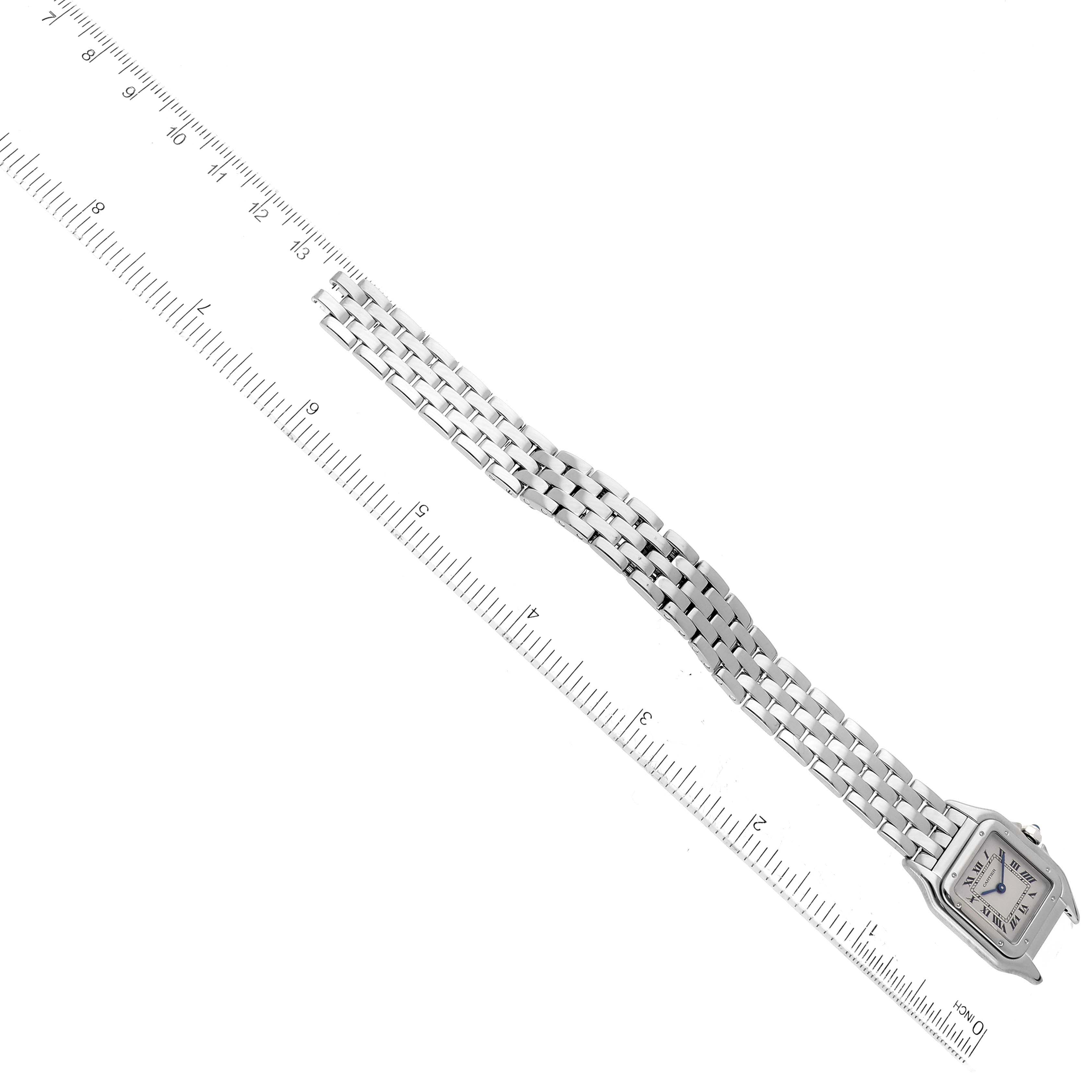 The Cartier Panthere W25016F3 Women's White Gold Silver Dial W25016F3 Women's White Gold Silver Dial watch is shown from a top-down angle, including the face, links, and a measurement ruler.