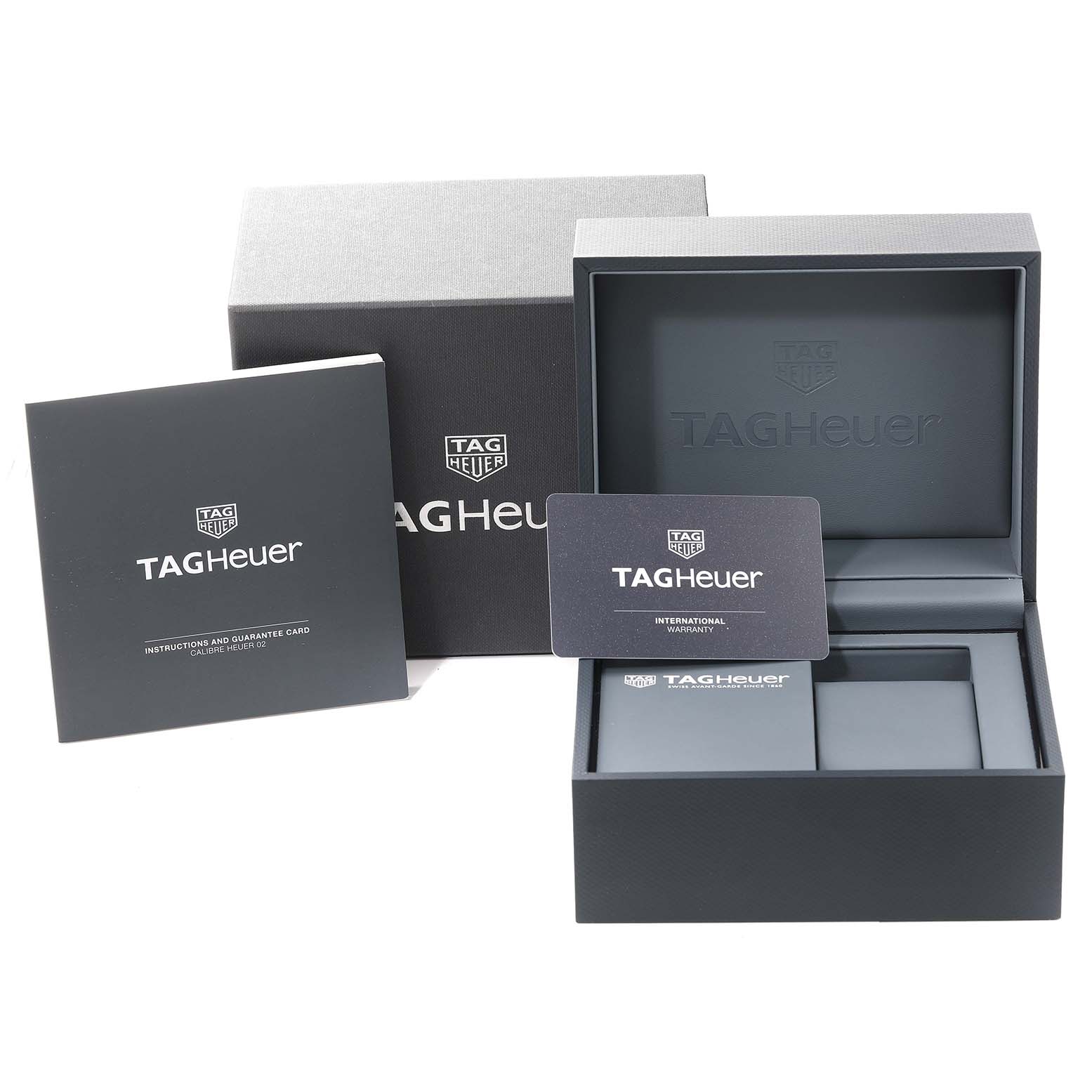 The image shows the packaging, international warranty card, and instruction booklet for a Tag Heuer Carrera CBN2A5A.FC6481 Men's Steel and Gold (two tone) Black Dial CBN2A5A.FC6481 Men's Steel and Gold (two tone) Black Dial watch.