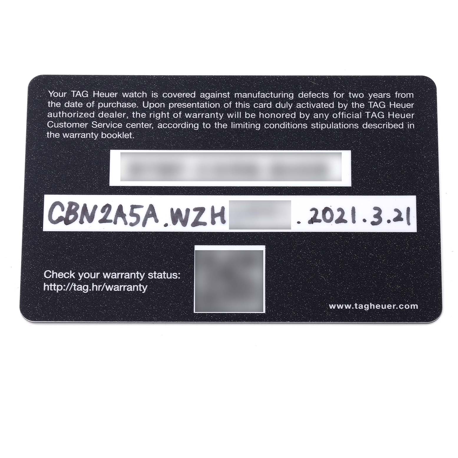 This image shows a close-up of a Tag Heuer Carrera CBN2A5A.FC6481 Men's Steel and Gold (two tone) Black Dial CBN2A5A.FC6481 Men's Steel and Gold (two tone) Black Dial warranty card.