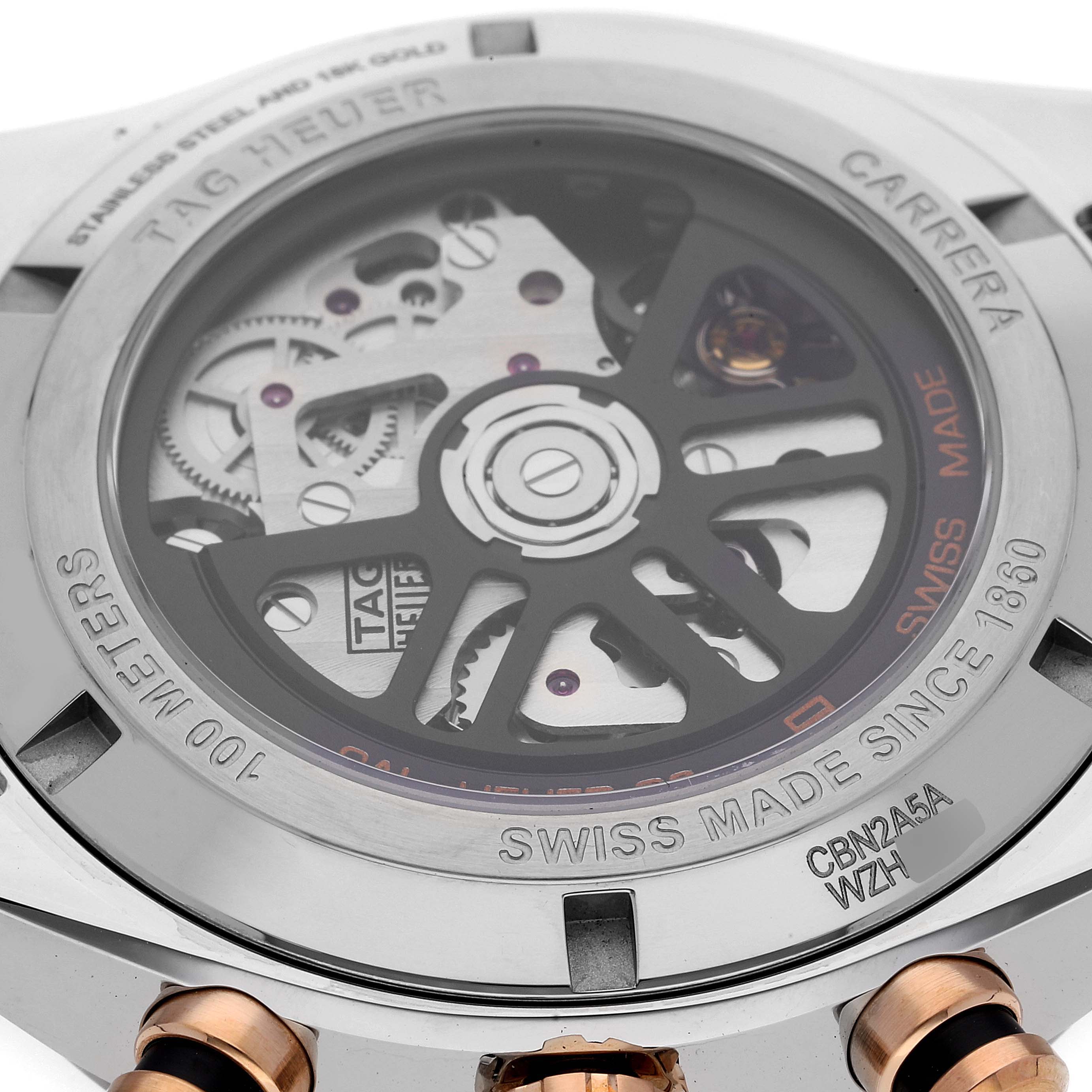 This is a close-up view of the case back of a Tag Heuer Carrera CBN2A5A.FC6481 Men's Steel and Gold (two tone) Black Dial CBN2A5A.FC6481 Men's Steel and Gold (two tone) Black Dial watch, showing its mechanical movement and markings.