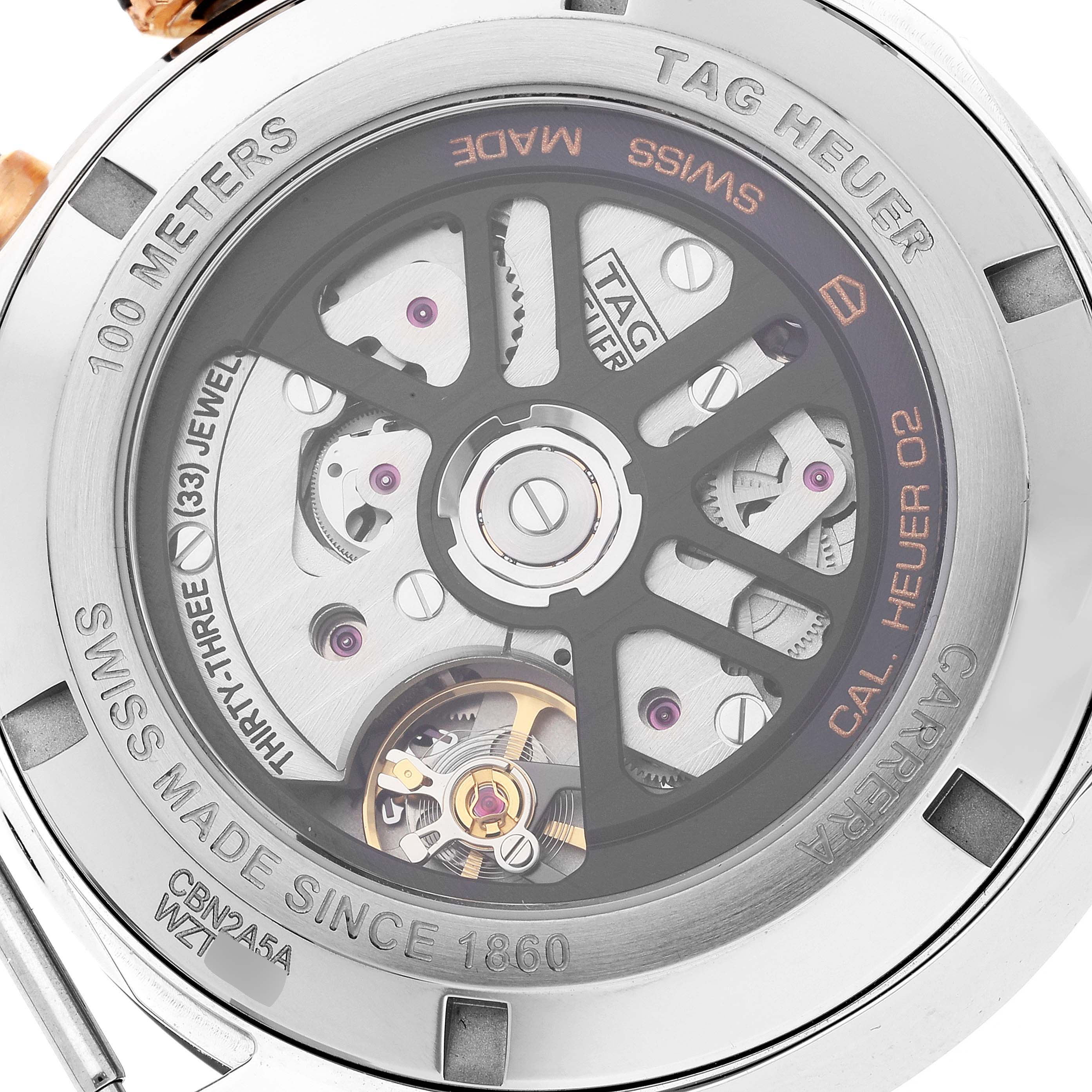 The image shows the back view of a Tag Heuer Carrera CBN2A5A.FC6481 Men's Steel and Gold (two tone) Black Dial CBN2A5A.FC6481 Men's Steel and Gold (two tone) Black Dial watch, highlighting its intricate automatic movement mechanism.