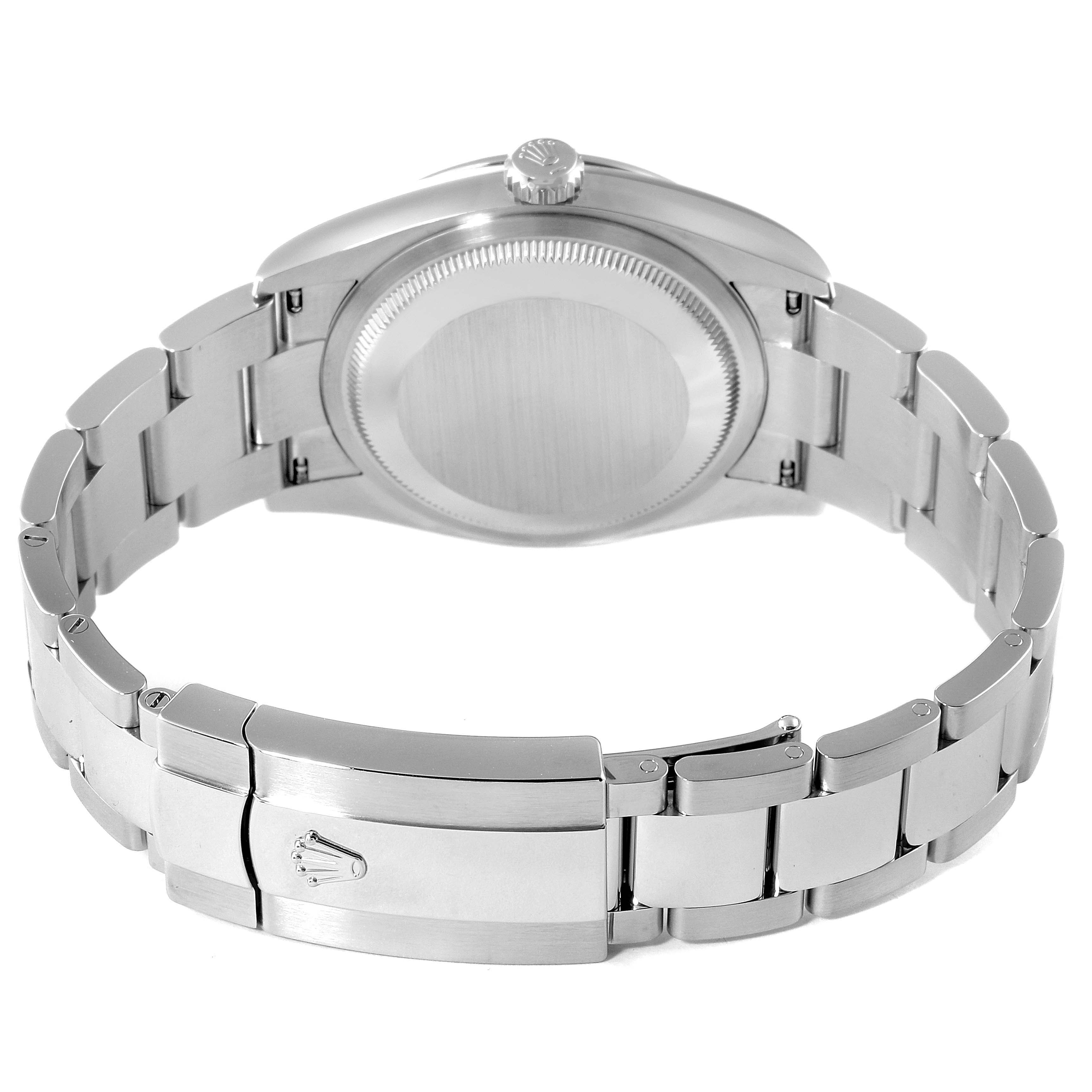 This is an image of a Rolex Datejust 126200 Men's Stainless Steel White Dial 126200 Men's Stainless Steel White Dial watch viewed from the back, showcasing the case back, bracelet, and clasp.