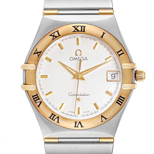 The image shows a front view of an Omega Constellation 1312.30.00 Men's Steel and Gold (two tone) Silver Dial 1312.30.00 Men's Steel and Gold (two tone) Silver Dial watch highlighting its dial, hands, bezel, and part of the bracelet.