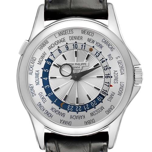 The Patek Philippe Complications 5130G-001 Men's White Gold Silver Dial 5130G-001 Men's White Gold Silver Dial watch is shown from a top-down angle, displaying the dial, cities, and time zone indicators.
