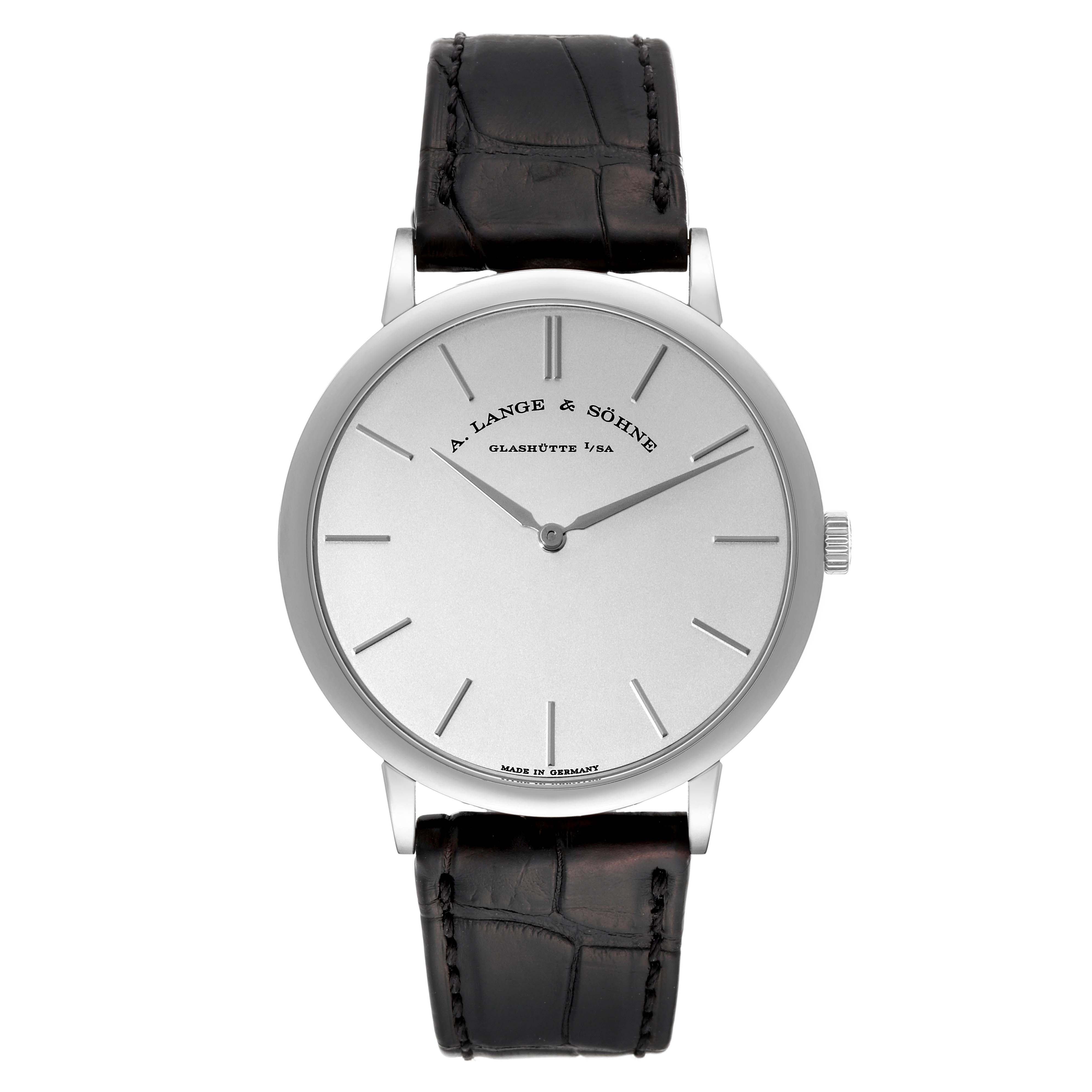 The image shows a front view of the A. Lange & Sohne Saxonia 211.027 Men's White Gold Silver Dial watch, displaying its dial, hands, crown, and leather strap.