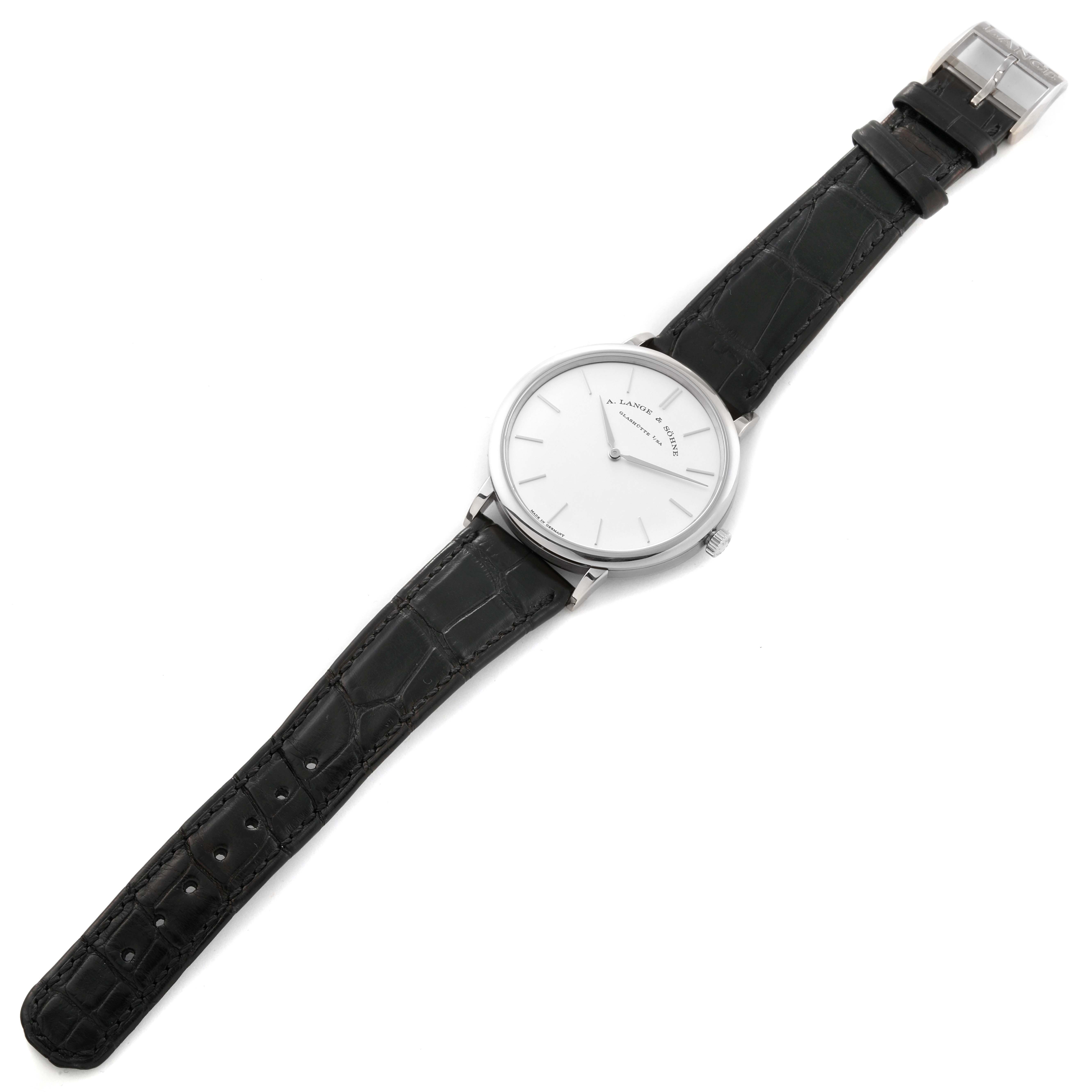 The Saxonia model by A. Lange & Söhne is shown from a top-down angle, featuring its face, case, and leather strap.