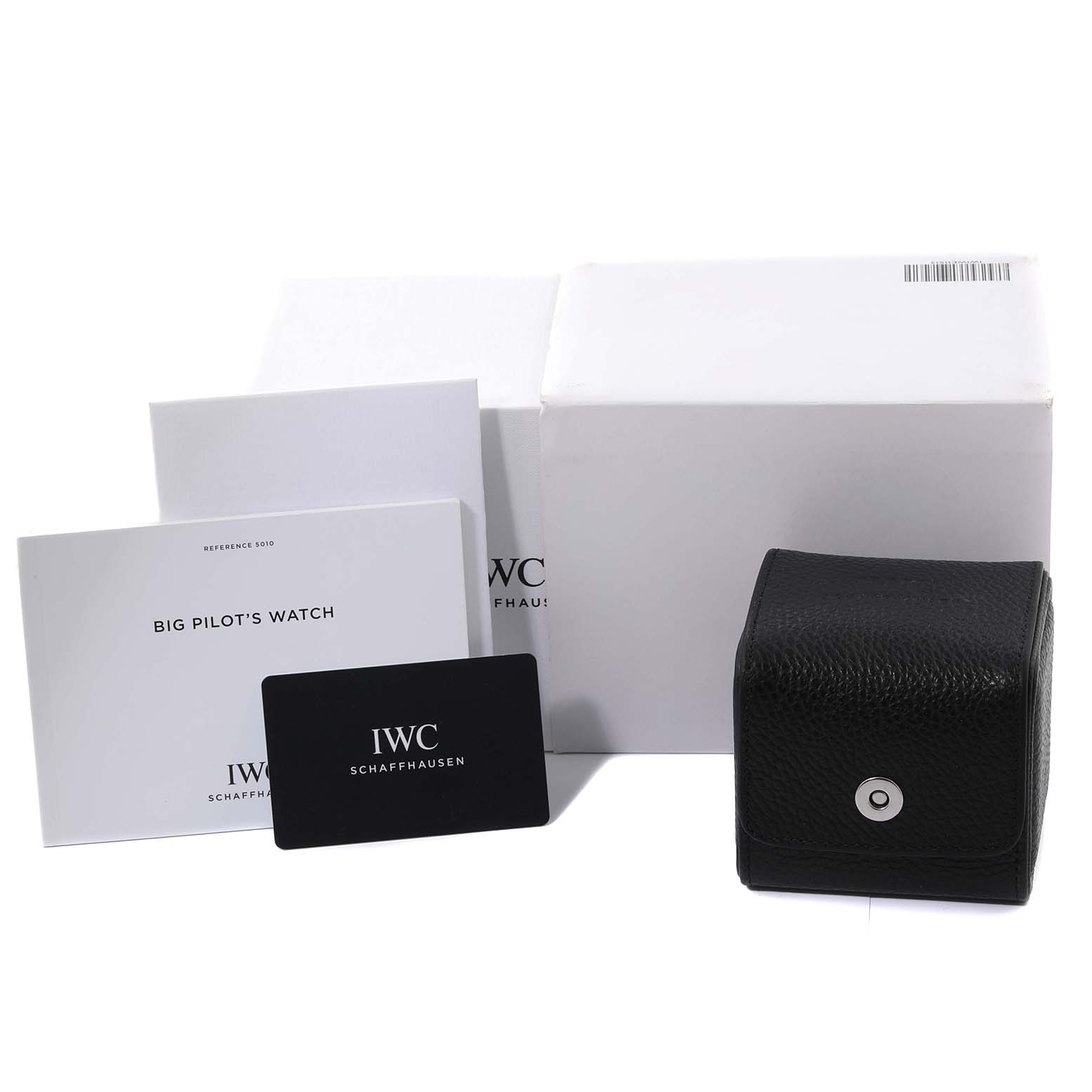 The image shows packaging, manuals, a card, and a case for an IWC Big Pilot's Watch, but not the watch itself.