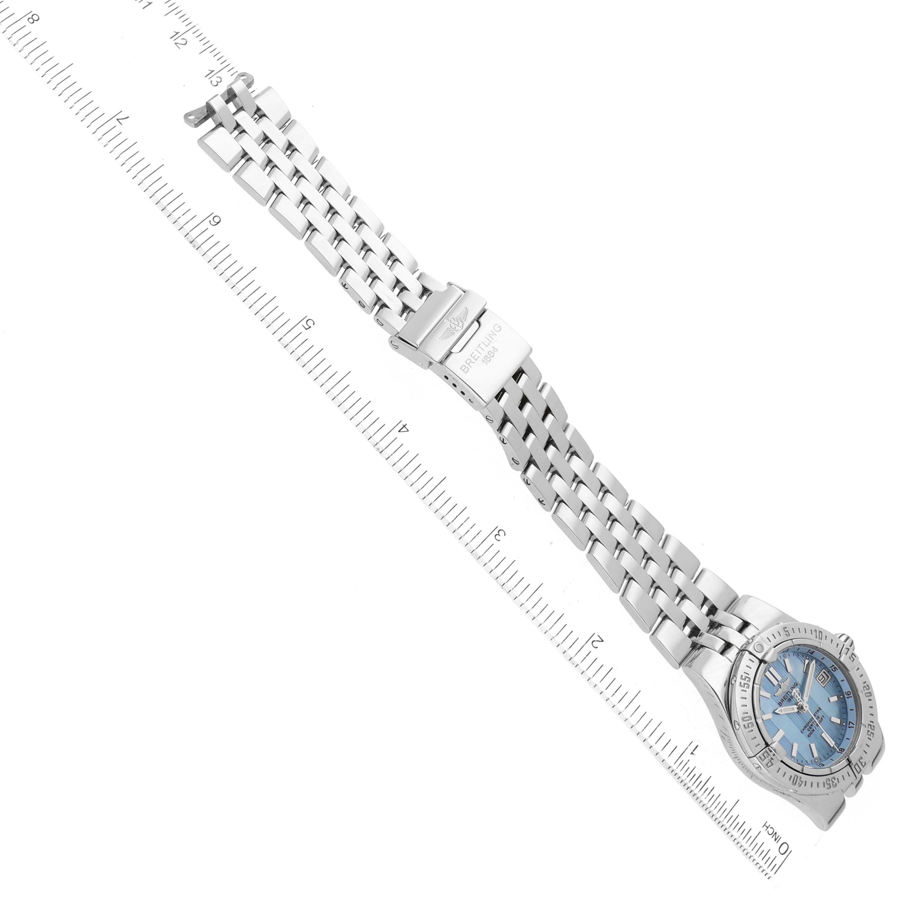 The image shows the Breitling A71340 Women's Stainless Steel Mother of Pearl Dial A71340 Women's Stainless Steel Mother of Pearl Dial Starliner Blue Mother of Pearl Dial Steel Ladies Watch A71340 laid flat with a ruler for scale.