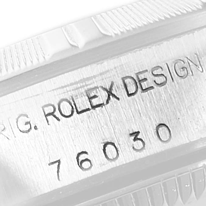 The image shows a close-up of the case side of a Rolex Oyster Perpetual 76030 Women's Stainless Steel White Dial 76030 Women's Stainless Steel White Dial watch, highlighting the engraved model number.