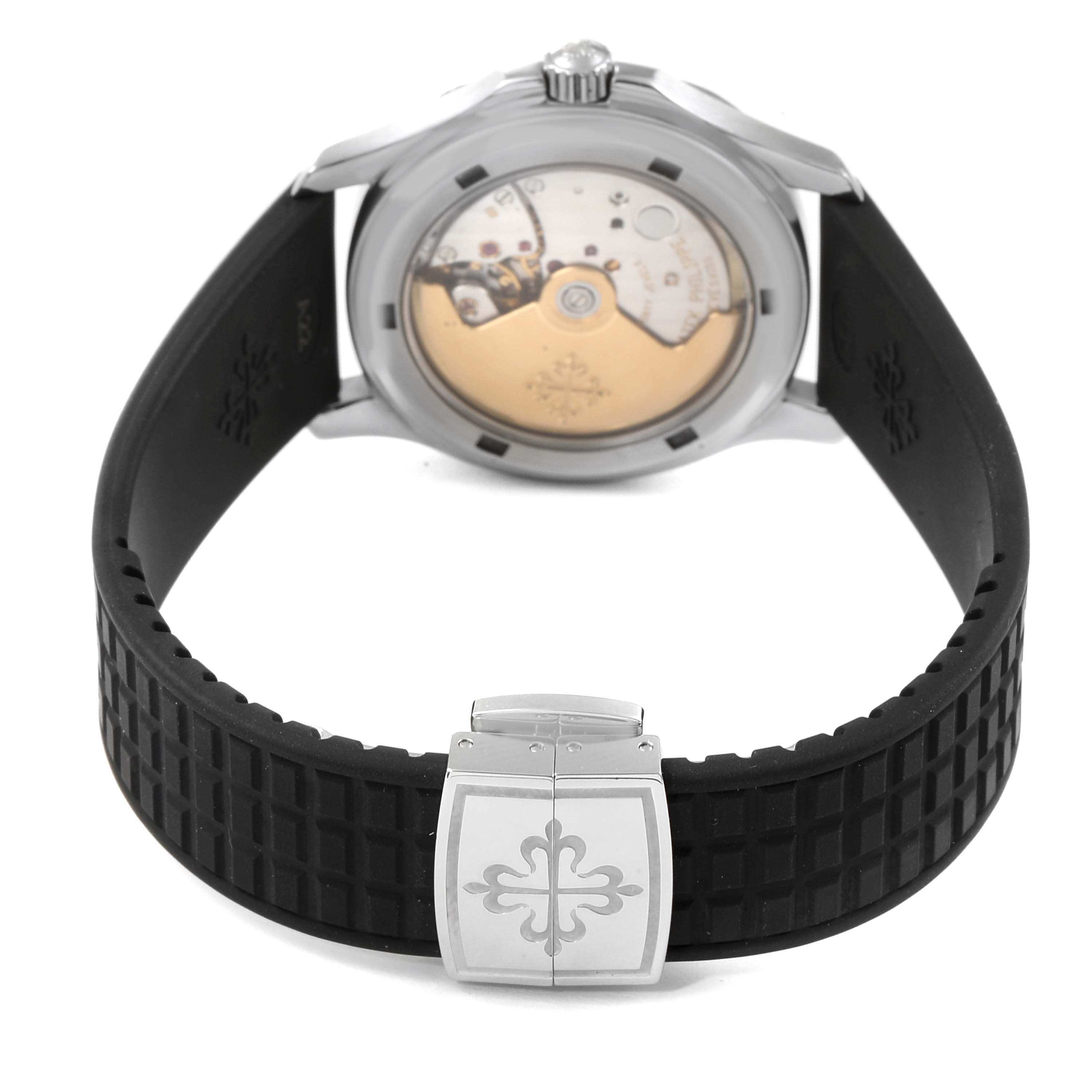 The image shows the back view of a Patek Philippe Aquanaut 5066 Men's Stainless Steel Black Dial 5066 Men's Stainless Steel Black Dial watch, highlighting the movement and the black rubber strap with a clasp.