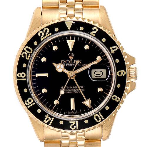 The image shows a frontal view of a Rolex GMT-Master 16758 Men's Yellow Gold Black Dial 16758 Men's Yellow Gold Black Dial watch, highlighting its dial, bezel, and part of the bracelet.