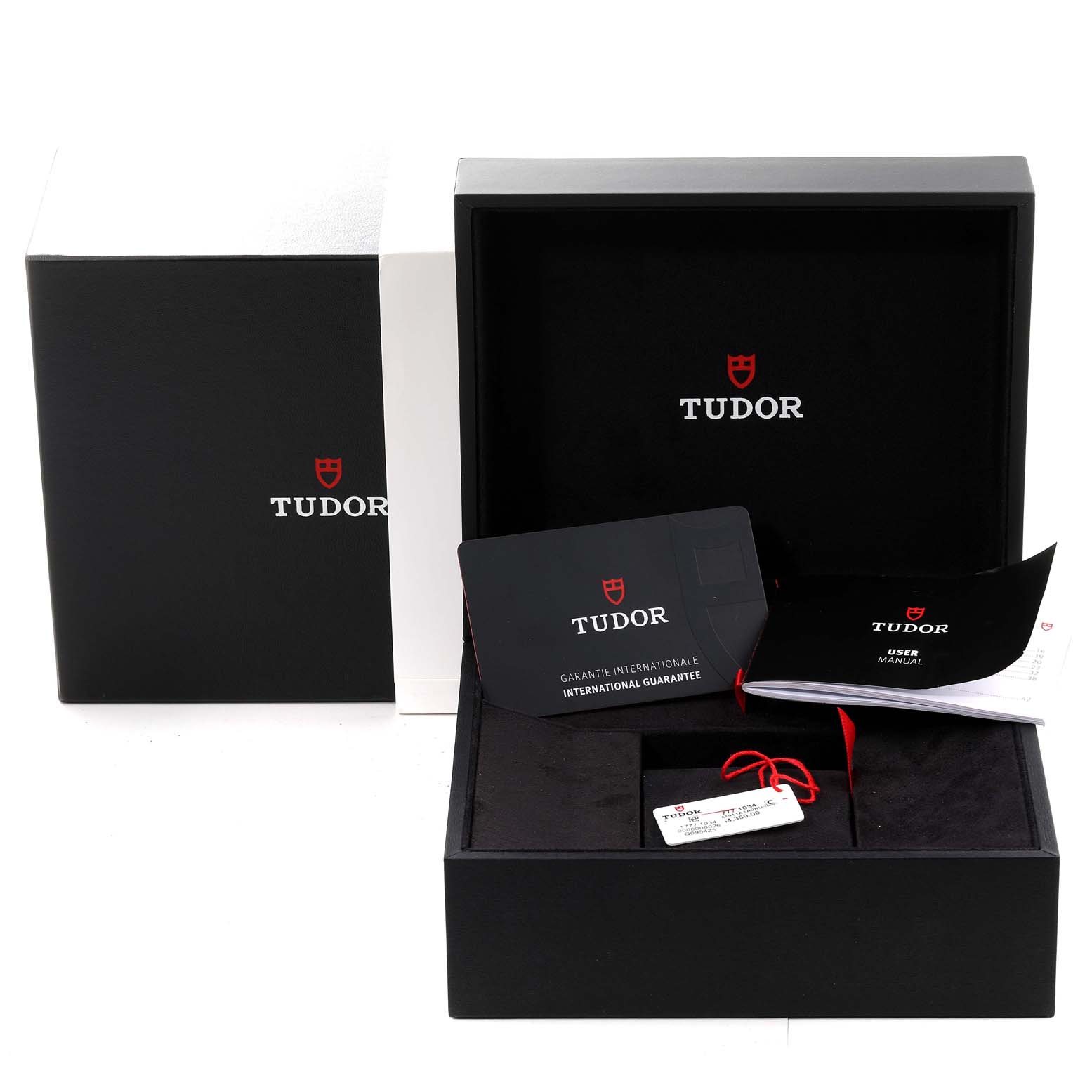 The image shows the packaging, international guarantee card, user manual, and tags for the Tudor Heritage Black Bay M7941A1A0RU-0001 Men's Stainless Steel Black Dial M7941A1A0RU-0001 Men's Stainless Steel Black Dial watch model.