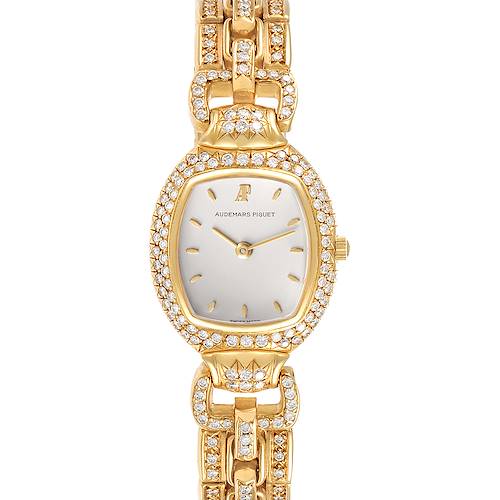 The image shows a frontal view of a vintage Audemars Piguet watch, highlighting its gold and diamond-encrusted case and bracelet.