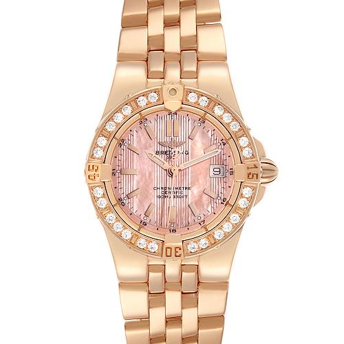 The Breitling H71340 Women's Rose Gold Mother of Pearl Dial H71340 Women's Rose Gold Mother of Pearl Dial Starliner H71340 watch is shown from a top-down angle, highlighting its gold bracelet, pink mother-of-pearl dial, and diamond bezel.