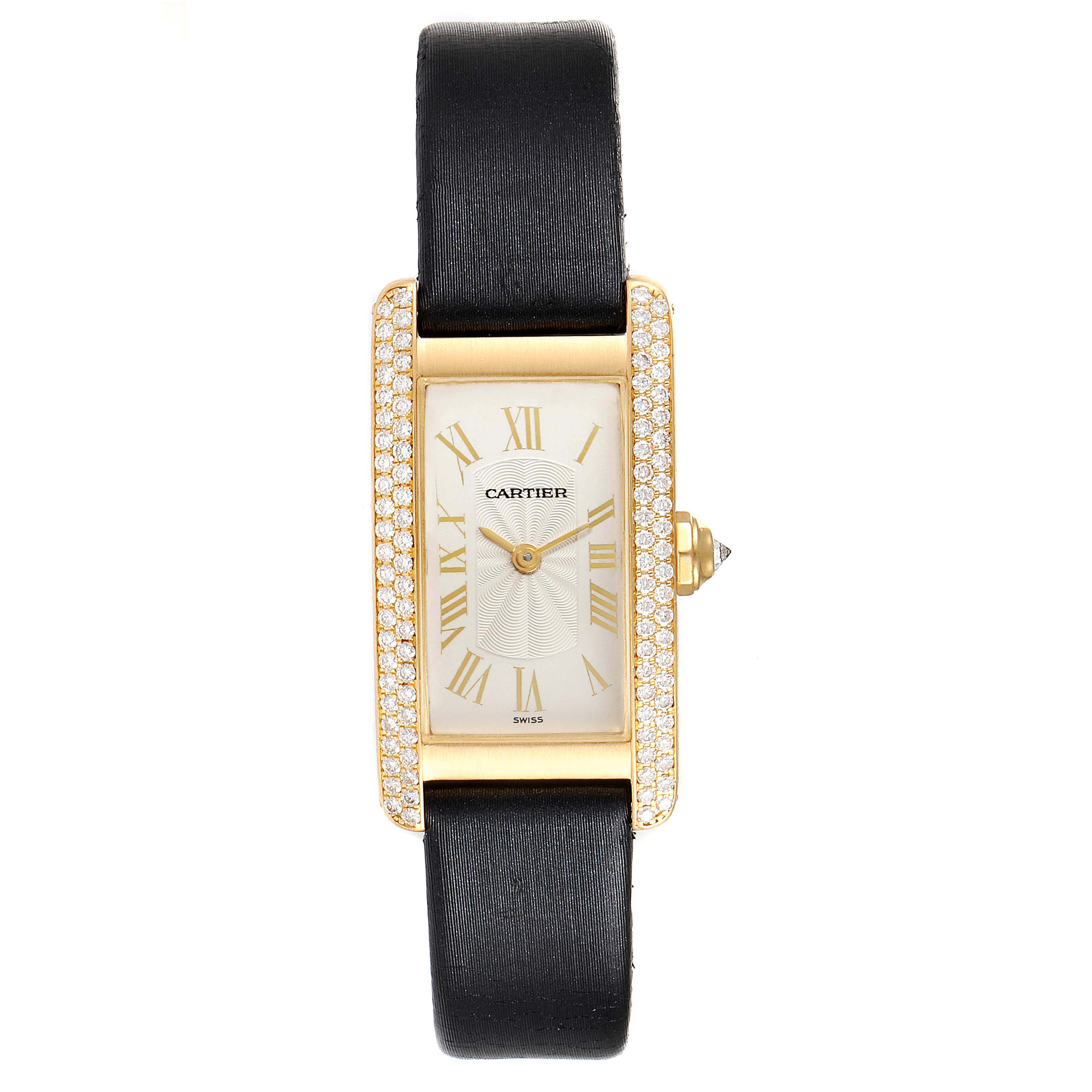 Front view of Cartier’s Tank Americaine watch displaying the face, Roman numerals, bezel, and black strap.