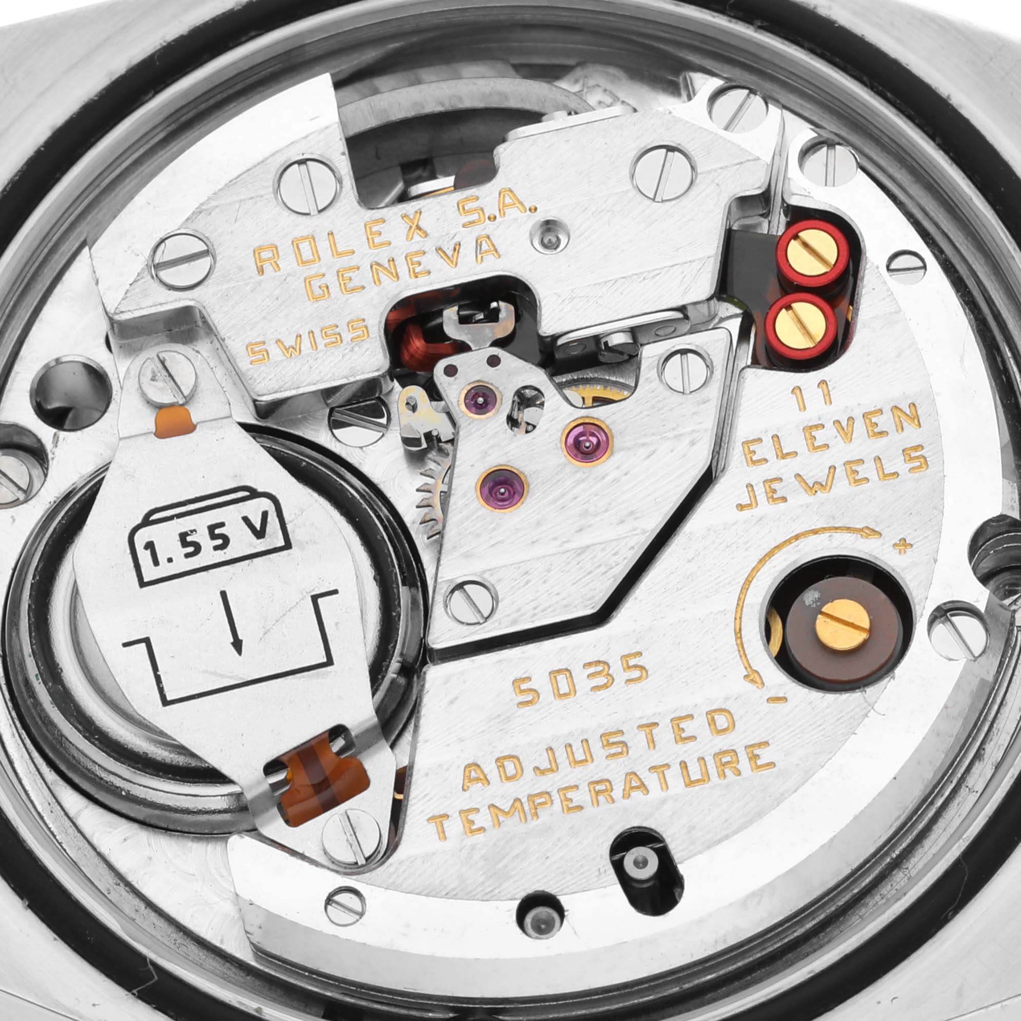 This close-up image shows the internal mechanism of a Rolex Oysterquartz 17013 Men's Steel and Gold (two tone) White Dial 17013 Men's Steel and Gold (two tone) White Dial model watch, including its jewels and battery compartment.