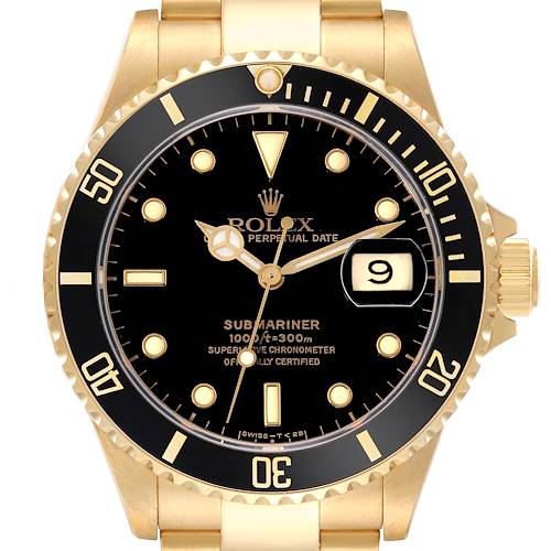 This is a front view of the Rolex Submariner 16618 Men's Yellow Gold Black Dial 16618 Men's Yellow Gold Black Dial watch showing the dial, bezel, markers, hands, and the date window.
