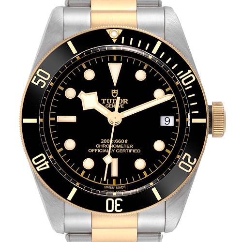 The image shows a front view of a Tudor Heritage Black Bay 79733 Men's Steel and Gold (two tone) Black Dial 79733 Men's Steel and Gold (two tone) Black Dial watch, highlighting its black dial, gold accents, and date display.