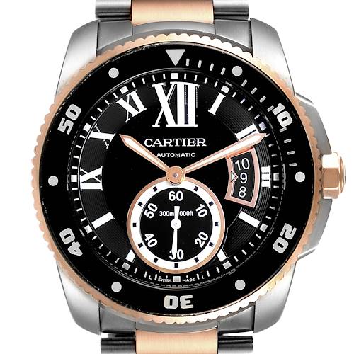 The image shows a front view of the Calibre de Cartier watch by Cartier, displaying its face, bezel, and part of its bracelet.