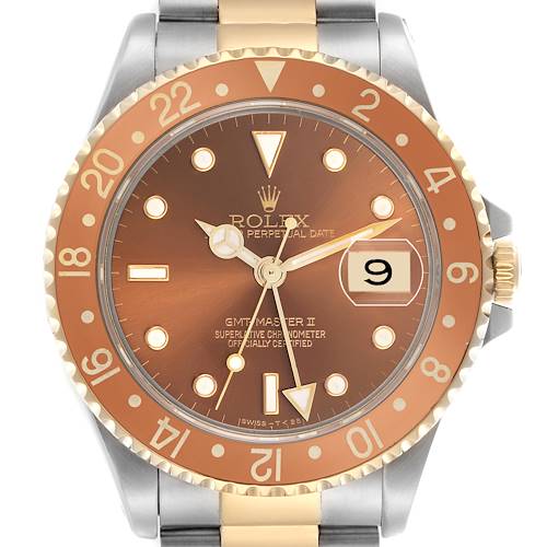 The Rolex GMT-Master 16713 Men's Steel and Gold (two tone) Brown Dial 16713 Men's Steel and Gold (two tone) Brown Dial II watch is shown from a front angle, highlighting its copper dial, two-tone bezel, and bracelet.