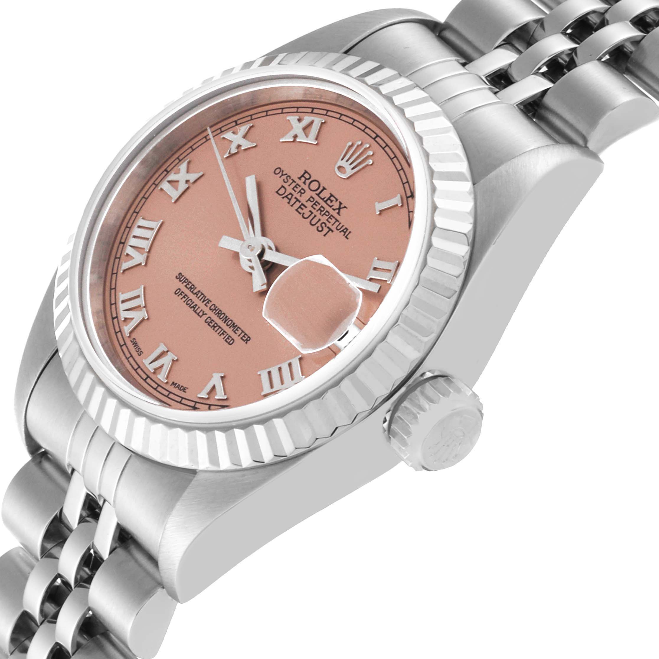 The image shows a close-up, angled view of a Rolex Datejust 79174 Women's Stainless Steel Pink Dial 79174 Women's Stainless Steel Pink Dial watch, highlighting the dial, bezel, crown, and part of the bracelet.