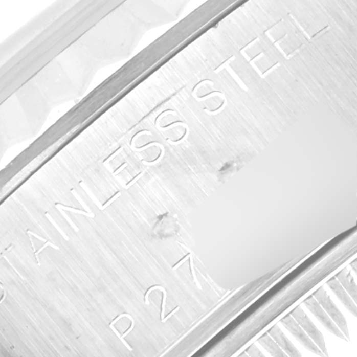 This image shows a close-up angle of the Rolex Datejust 79174 Women's Stainless Steel Pink Dial 79174 Women's Stainless Steel Pink Dial model's stainless steel case with part of the serial number visible.