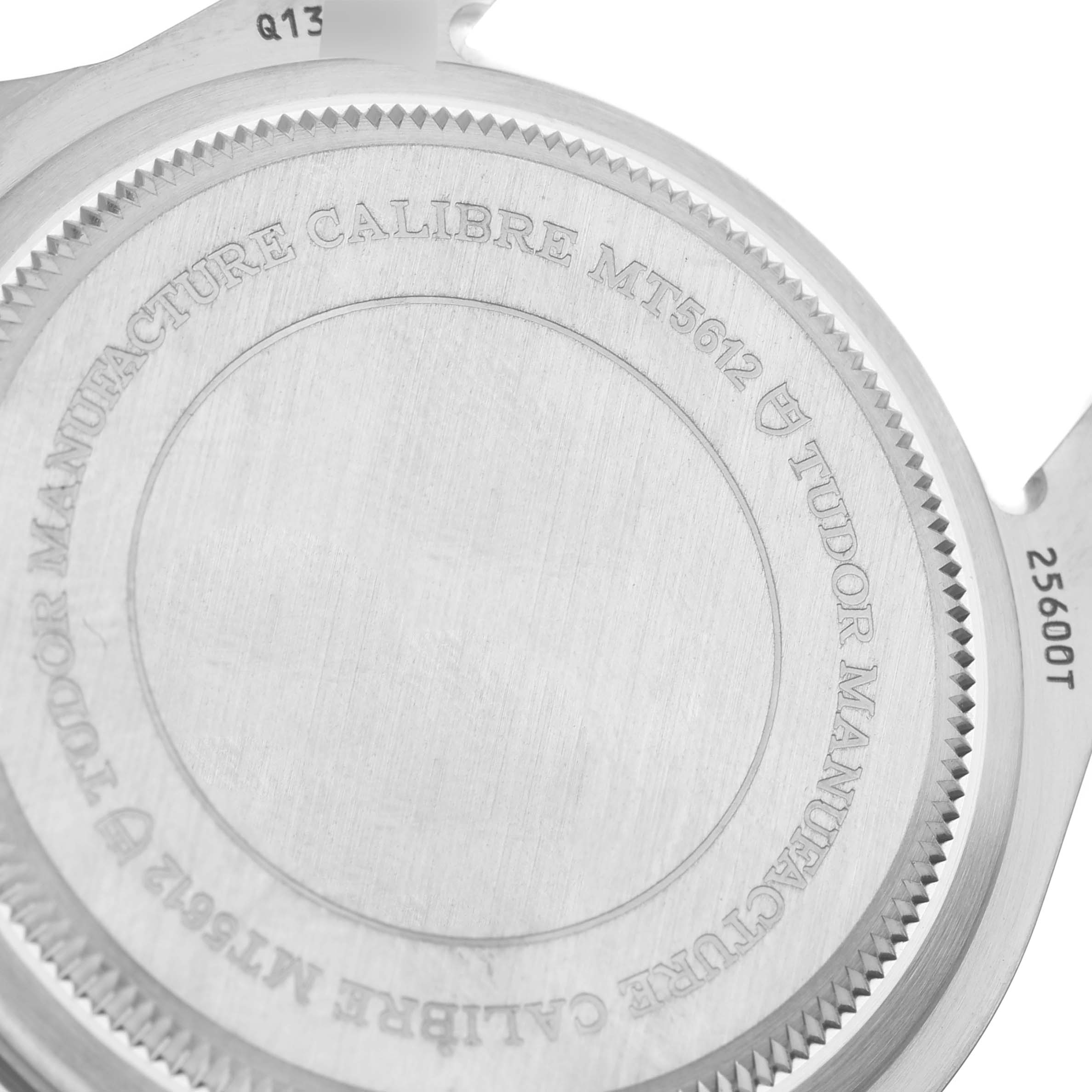 The image shows the case back of a Tudor Pelagos 25600TN Men's Titanium Black Dial 25600TN Men's Titanium Black Dial watch, displaying the model's specifications and the brand's engraving.