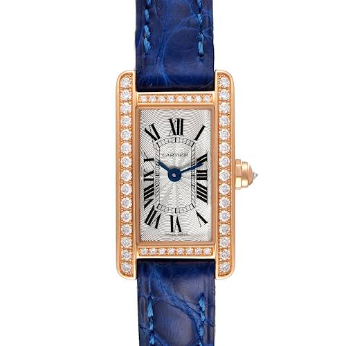 The image shows a frontal view of the Cartier Tank Americaine WJTA0026 Women's Rose Gold Silver Dial WJTA0026 Women's Rose Gold Silver Dial watch with a blue strap and a diamond-encrusted rectangular case.