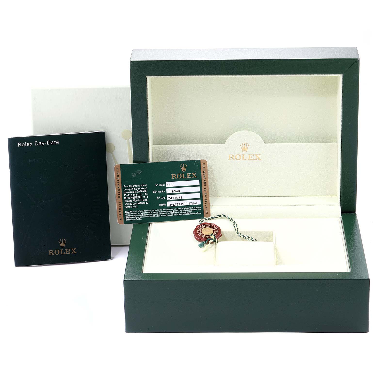 The image shows the packaging, warranty card, booklet, and a tag of a Rolex President 118348 Men's Yellow Gold Green Dial 118348 Men's Yellow Gold Green Dial model watch.