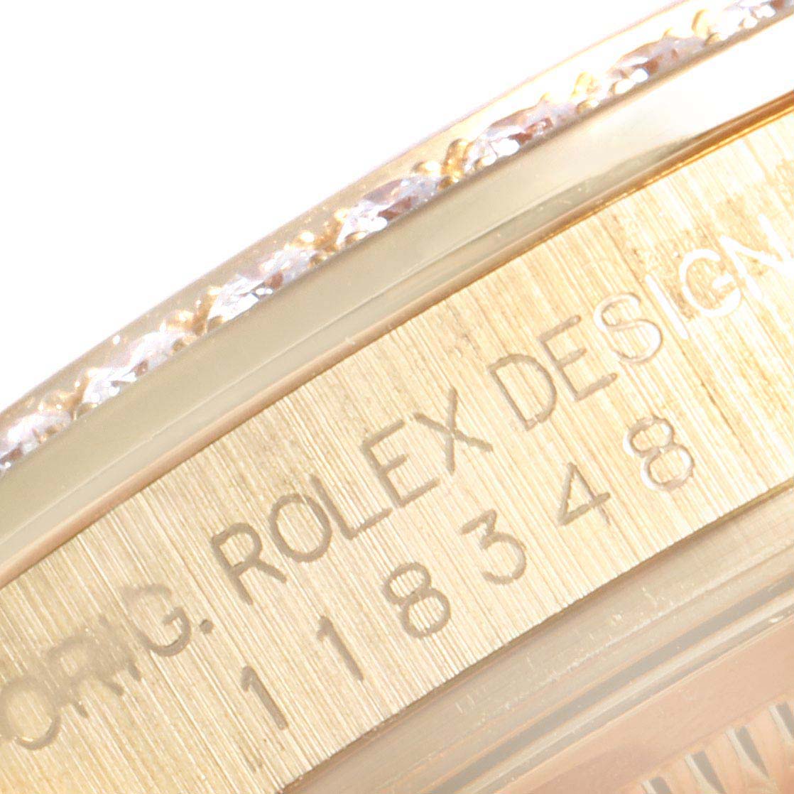 This image shows a close-up of the side view of the Rolex President 118348 Men's Yellow Gold Green Dial 118348 Men's Yellow Gold Green Dial model, highlighting its engraved design details and bezel.