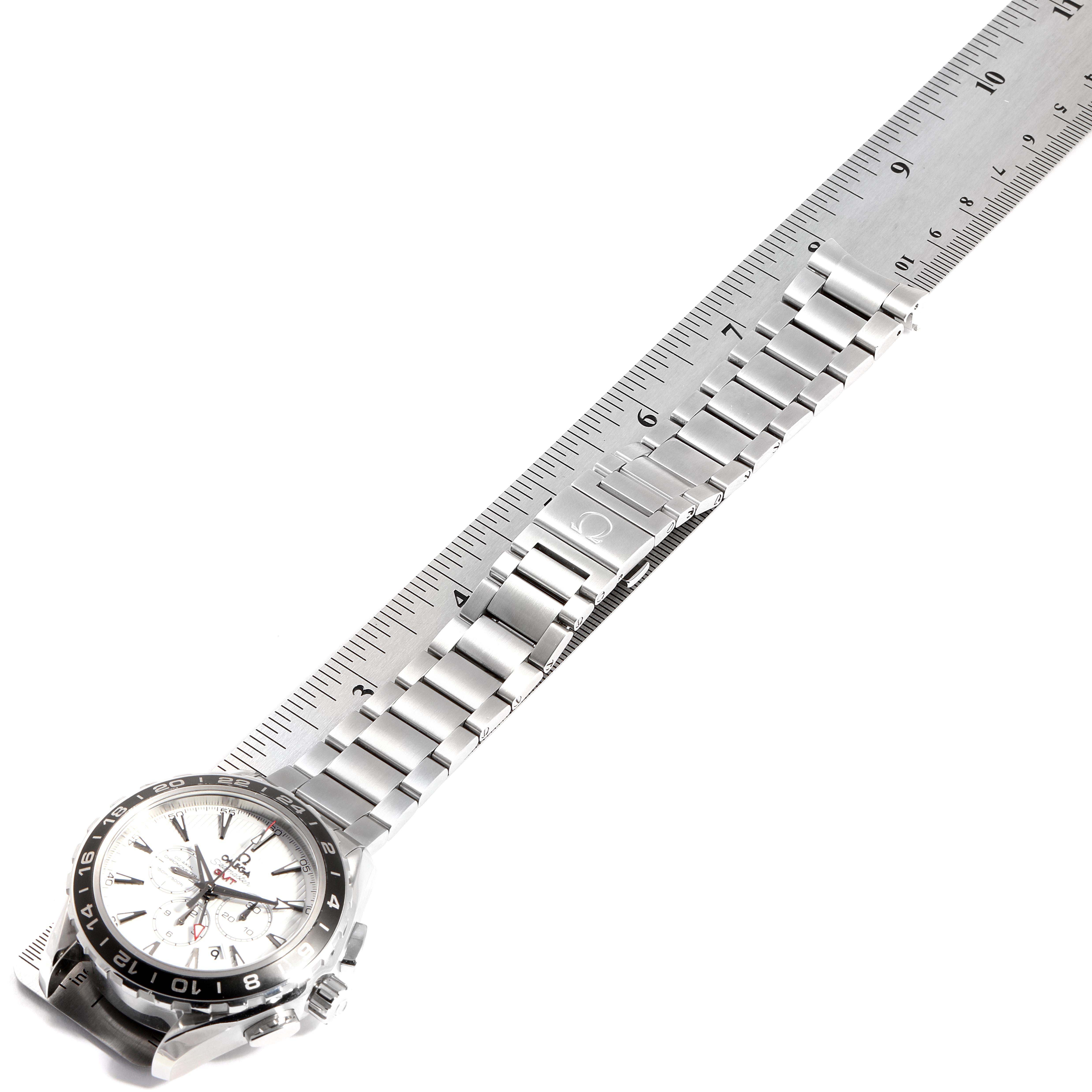The image shows the Omega Aqua Terra 231.10.44.52.04.001 Men's Stainless Steel White Dial 231.10.44.52.04.001 Men's Stainless Steel White Dial watch laid flat, with its stainless steel bracelet and clasp, next to a ruler for scale.