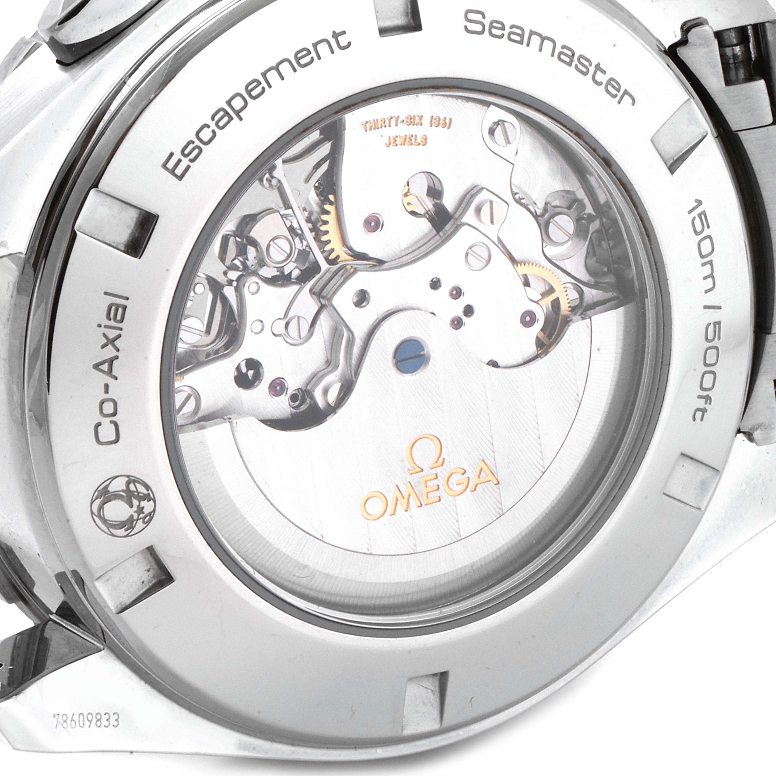The image shows the backside of the Omega Aqua Terra 231.10.44.52.04.001 Men's Stainless Steel White Dial 231.10.44.52.04.001 Men's Stainless Steel White Dial watch, displaying its intricate mechanical movements and branding.