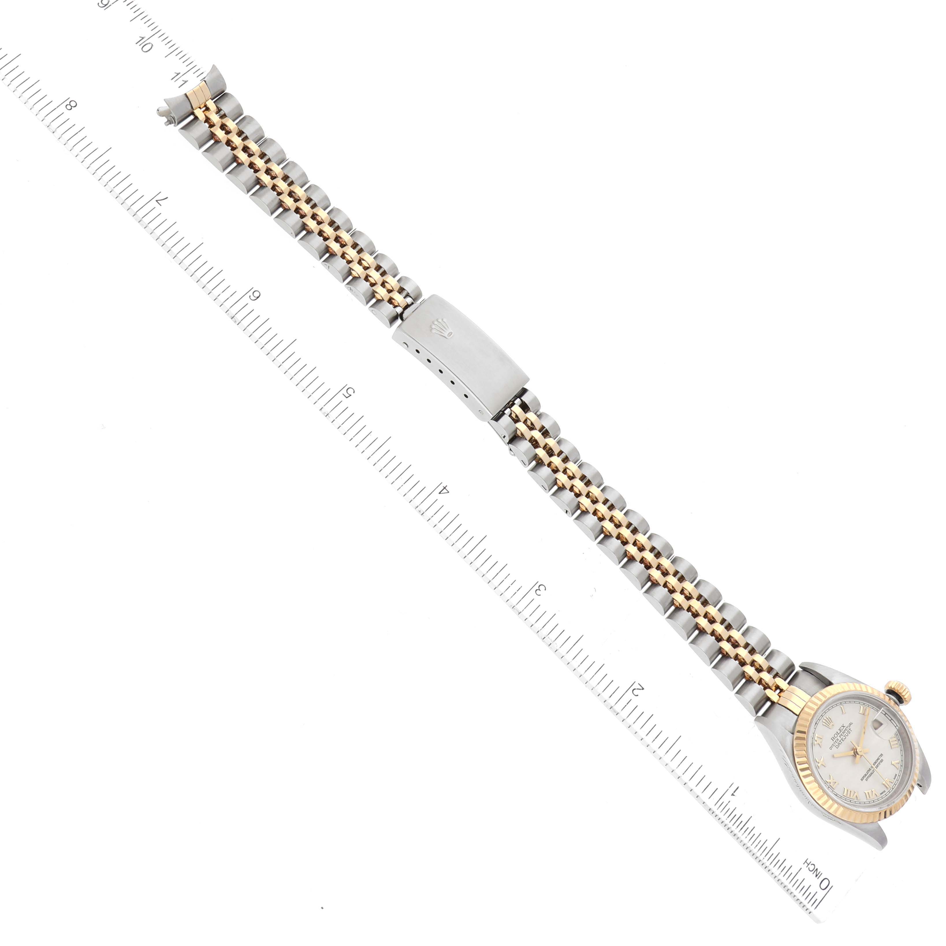 The image shows an overhead view of a Rolex Datejust 79173 Women's Steel and Gold (two tone) Beige Dial 79173 Women's Steel and Gold (two tone) Beige Dial watch, focusing on the full length of the band and face, with a measuring ruler beside it.