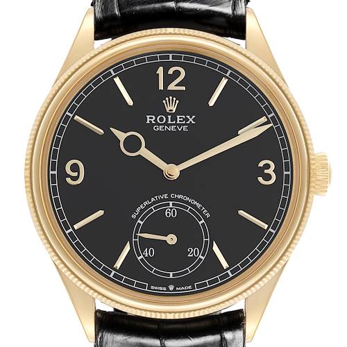 The Rolex 1908 52508-0002 Men's Yellow Gold Black Dial 52508-0002 Men's Yellow Gold Black Dial model is shown from a straight-on angle, highlighting the face, numerals, hands, and crown.