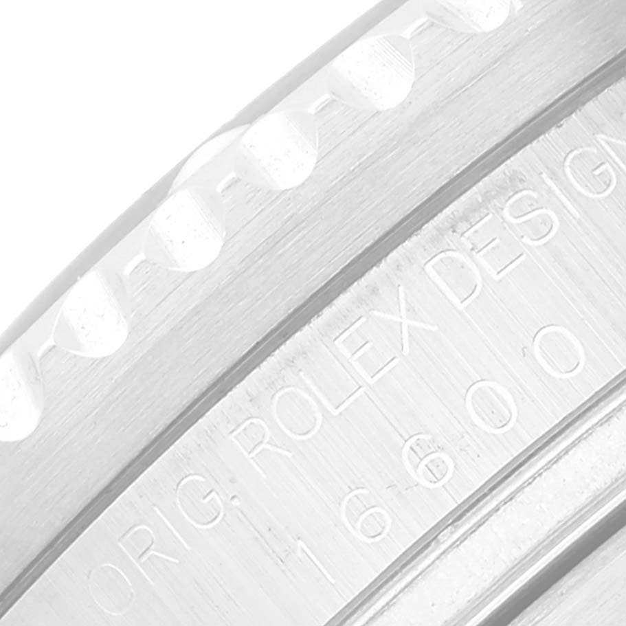 This close-up image shows the side view of the bezel and the engraved inner rim of a Rolex Sea-Dweller 16600 Men's Stainless Steel Black Dial 16600 Men's Stainless Steel Black Dial watch.