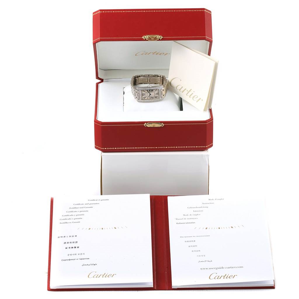 The image shows a Cartier Tank Americaine WB7073L1 Women's White Gold Silver Dial WB7073L1 Women's White Gold Silver Dial watch in its open red box, along with warranty documentation.