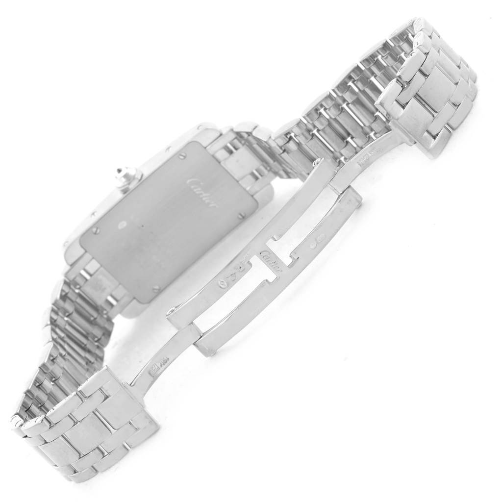 The image shows the underside and clasp mechanism of the Cartier Tank Americaine WB7073L1 Women's White Gold Silver Dial WB7073L1 Women's White Gold Silver Dial watch.