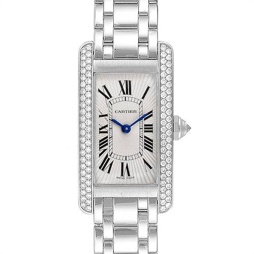The image shows a top-down view of the Cartier Tank Américaine watch, displaying its face, bezel, and part of the metal bracelet.
