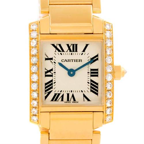 The image shows a Cartier Tank Francaise WE1001R8 Women's Yellow Gold Silver Dial WE1001R8 Women's Yellow Gold Silver Dial watch from a front angle, highlighting its gold case, diamond bezel, and Roman numeral dial.