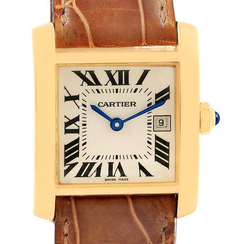 The image shows a front view of the Cartier Tank Francaise W50014N2 Women's Yellow Gold Silver Dial W50014N2 Women's Yellow Gold Silver Dial watch, highlighting the dial, Roman numerals, blue hands, date display, and brown leather strap.