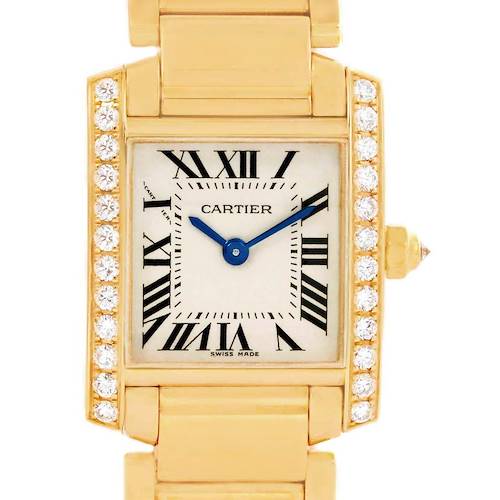The image shows a frontal close-up of the Cartier Tank Francaise WE1001R8 Women's Yellow Gold Silver Dial WE1001R8 Women's Yellow Gold Silver Dial watch, highlighting its gold case, diamond bezel, and Roman numeral dial.