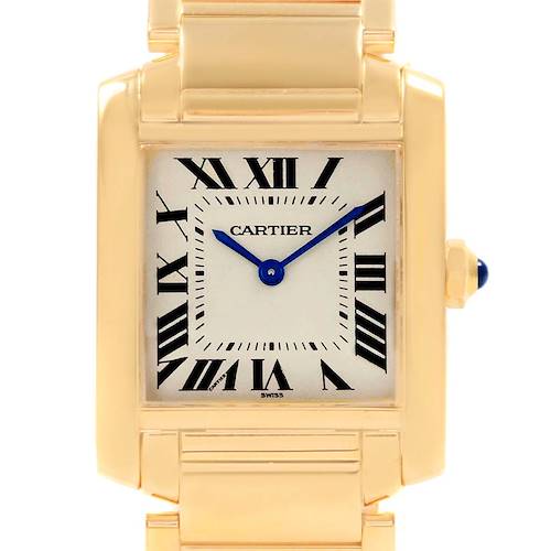 This image shows a close-up of the Cartier Tank Francaise W50003N2 Women's Yellow Gold Silver Dial W50003N2 Women's Yellow Gold Silver Dial's face and upper bracelet, featuring Roman numerals and blue hands.